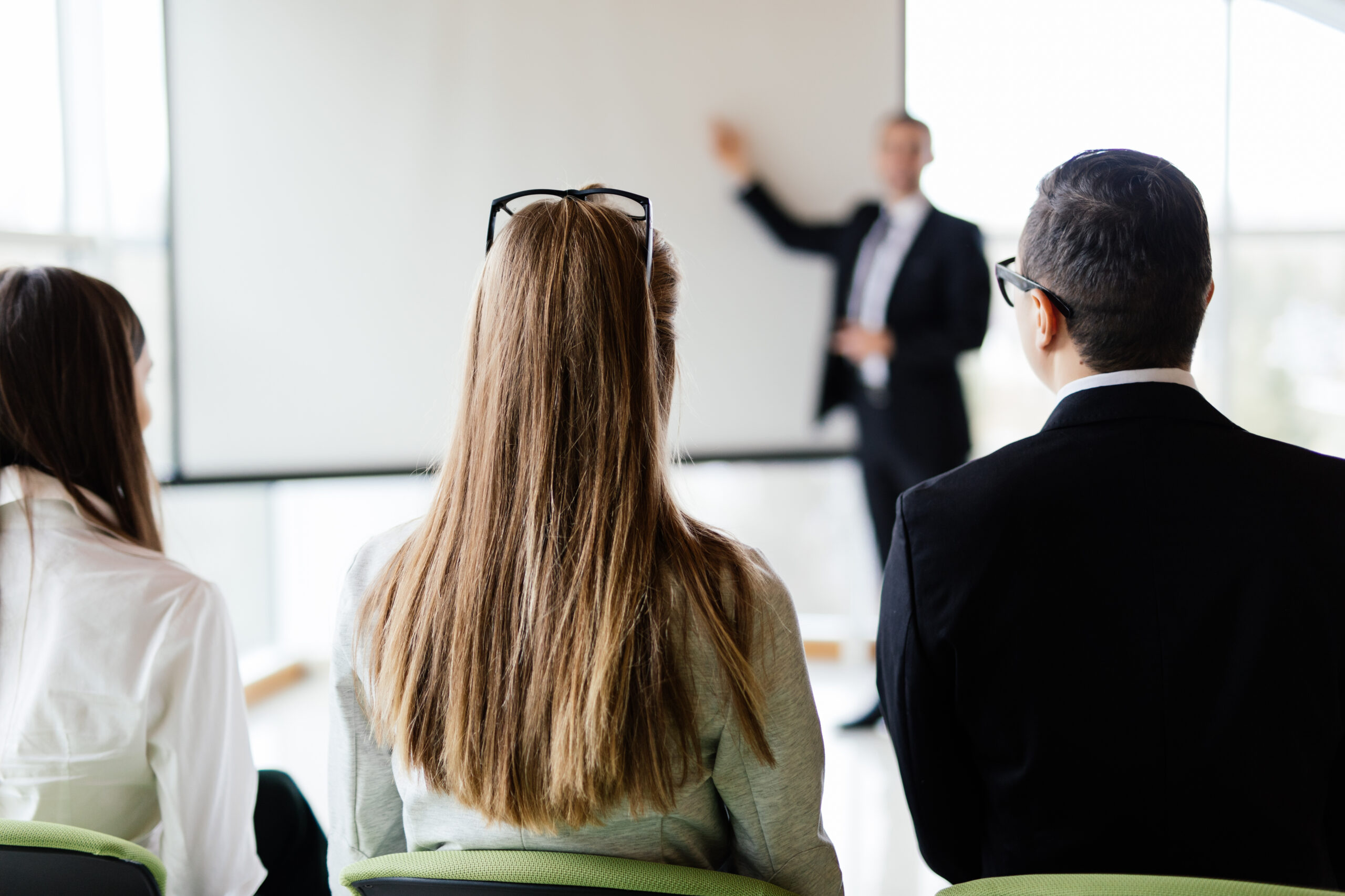 Corporate work. Coworkers at presentation on big conference room