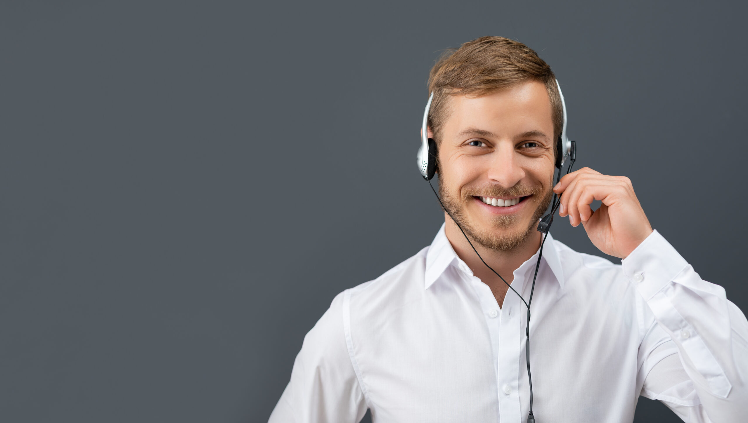 Call center employee isolated on a gray background.